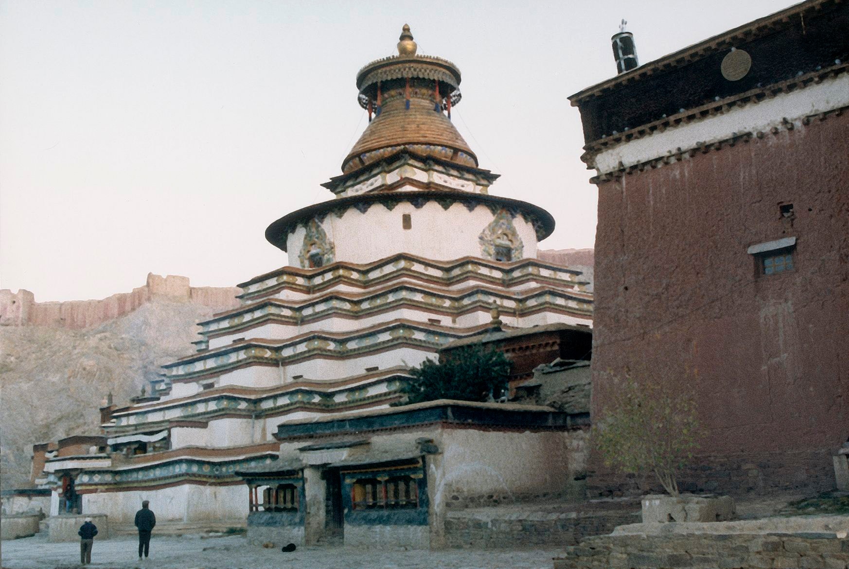 The Gyantse Kumbum stupa at dusk, prayer wheels along its base