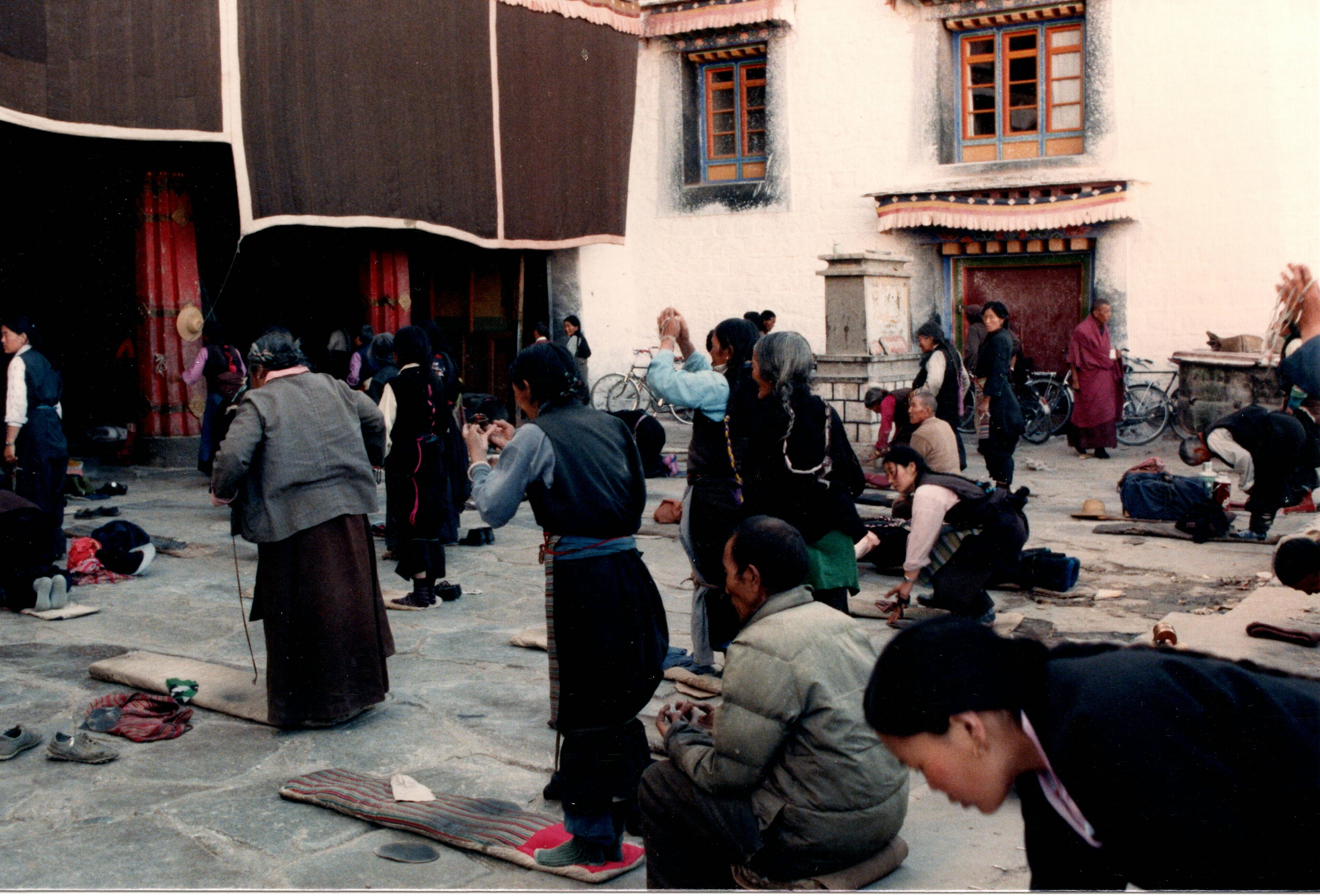 Pilgrims in the courtyard of the Jokhang Temple, Lhasa